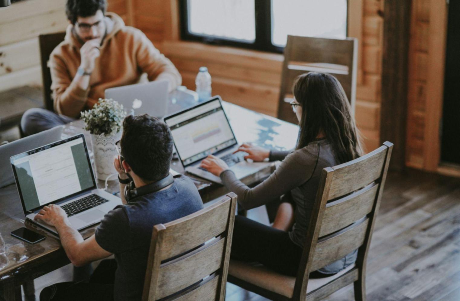 Professional financial analysis workspace with documents and data visualizations