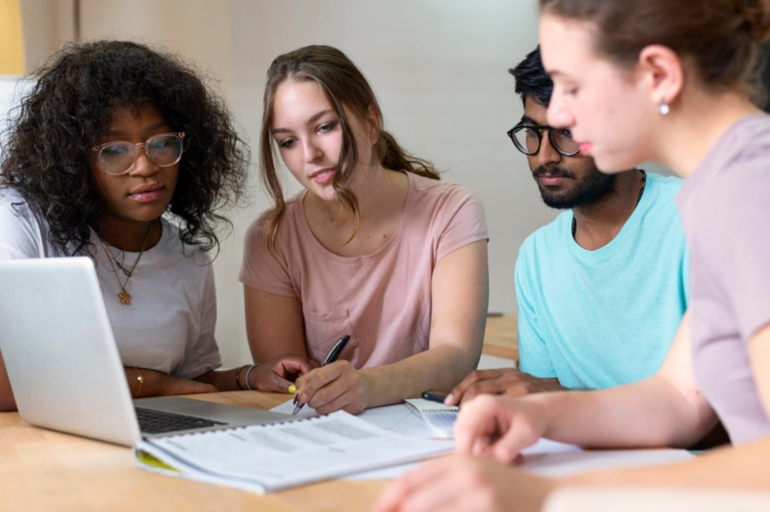 Team collaboration session discussing financial metrics and company comparisons